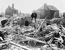 An Anderson shelter standing intact amid a scene of debris in Norwich The Home Front in Britain during the Second World War HU36196.jpg