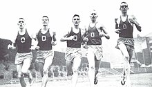 Knight (second from right) running track in 1958 Track runners 1958 - Phil Knight second from right.jpg