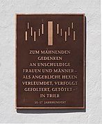 Plaque commemorating the victims of witch hunts at Simeonstift in Trier.