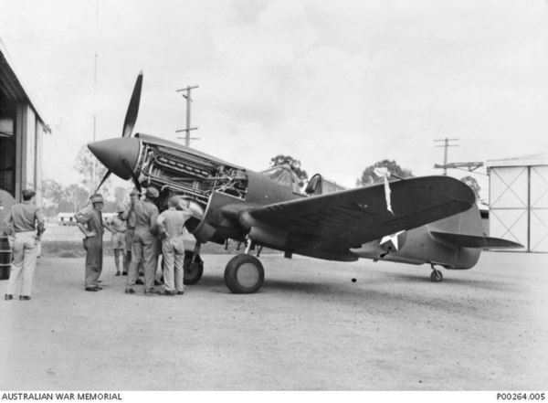 Mechanics assembling a P-40 in Archerfield, Queensland