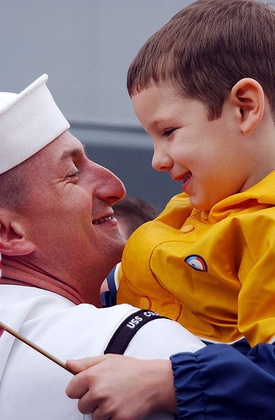 File:US Navy 020425-N-1110A-502 Sailor is greeted by son during homecoming.jpg