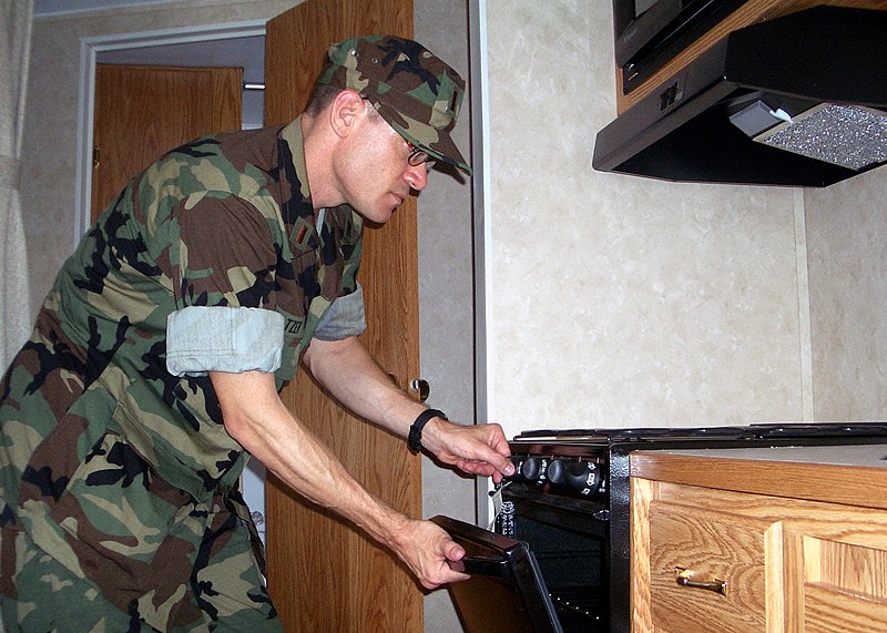 File:US Navy 050923-N-7231W-002 U.S. Navy Ens. Robert Seltzer, a reserve Supply Corps Officer temporarily assigned to Task Force Navy Family, inspects one of the temporary homes for Navy family members displaced when Hurricane Katri.jpg