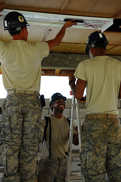 File:US Navy 081111-N-4515N-077 Air Force engineers hang lighting fixtures.jpg