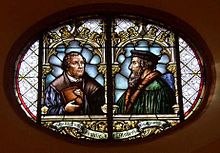 Glass window in the town church of Wiesloch (Stadtkirche Wiesloch) with Martin Luther and John Calvin commemorating the 1821 union of Lutheran and Reformed churches in the Grand Duchy of Baden. Union luthercalvin.jpg