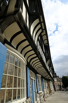 St William's College (York) facade. The curved wood protrusions are probably repurposed ship frames. YorkStWilliamsCollege1.jpg