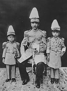 Zhang Zuolin with two of his sons, both wearing expensive miniature uniforms Zhang Zuolin with two sons.jpg