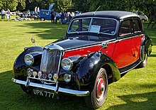 reshaped mudguards all round and no running boards, a 1954 car 1954 Riley RME 1.5 Litre saloon at Capel Manor, Enfield, London, England.jpg