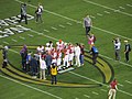 English: Alabama and Clemson players meet midfield for the coin toss at the 2019 College Football Playoff National Championship.