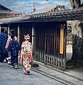 A girl in traditional Japanese clothes and a fox mask