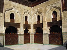 The courtyard of the Bou Inania Madrasa in Fes, built by the Marinids in the 14th century Ali Ben Youssef Medersa (15744610301).jpg