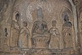 Ancient Buddhist Grottoes at Longmen- Old Dragon Grotto, Seated Buddha and Attendants, Tang Dynasty.jpg