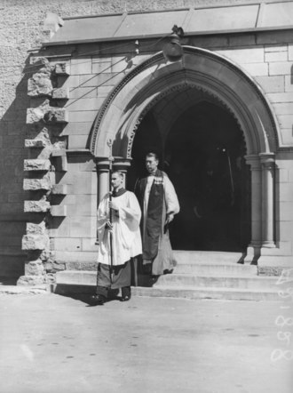 Archbishop Wand leaving St John's Cathedral, Brisbane after service on ANZAC Day, 25 April 1937 Archibishop of Brisbane Dr. John Wand leaving St. Johns Cathedral after service on ANZAC Day 25 April 1937.tiff