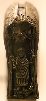 A bishop impaling a dragon with the base of his staff on the drop plate Bastone pastorale di clonmacnoise, XI secolo 02 (cropped).jpg