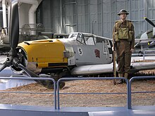 Tableau of crashed Bf 109E in Hangar 4. Bf109atimperialwarmuseumduxford.jpg