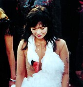 Björk wearing a dress shaped like a swan.