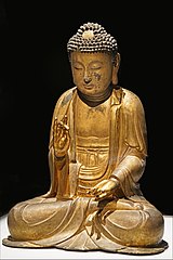 Bouddha assis faisant le geste de la prédication