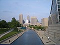 Skyline of downtown Indianapolis from the canal with the Medal of Honor Memorial and Indiana State Museum on the sides