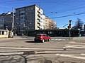 Car waits for tram (43049061695).jpg