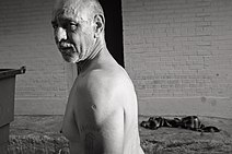 A man in San Antonio, Texas, with an arm tattoo of the word Chicano. Photo by Jesse Acosta. ChicanoManTattoo.jpg