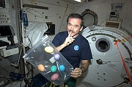 Chris Hadfield with bag of Easter eggs.jpg