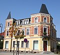 Apartment house in a corner and open development