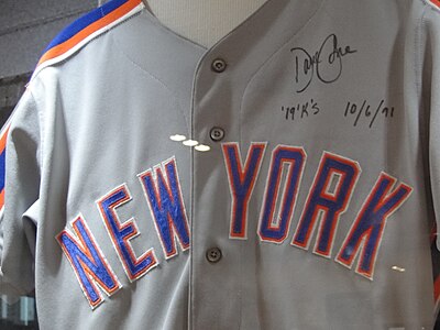 The Mets adopted this "NEW YORK" block wordmark for their road jerseys in 1988, adding white trim and removing the front numerals, and switched from pullovers to button-downs in 1991.