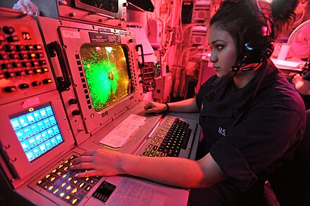 ACDS aboard a US aircraft carrier in the Persian Gulf during Operation New Dawn, Apr 2011 Defense.gov News Photo 110426-N-0569K-005 - Seaman Nathalie G. Sanchez operates an advanced combat direction system console in the commanding officer s tactical plot room aboard the aircraft.jpg