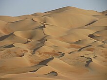 Rub' al Khali desert, surrounded by Saudi Arabia, Oman, United Arab Emirates, and Yemen. The Jakku sequences were filmed in the UAE section near the Liwa Oasis, which is under the governance of Abu Dhabi. Dune ranges (4184948167).jpg