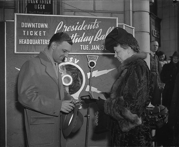 Eleanor Roosevelt buys the first ticket for the 1940 President's Birthday Ball