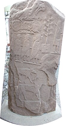 Rear of stone, showing sculpted figures and symbols Eassie Stone back.JPG