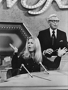 Ludden with Elizabeth Montgomery on Password in 1972 Elizabeth Montgomery Allen Ludden Password 1971.jpg