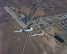 Two T-46 aircraft circling Edwards AFB Fairchild T-46-2.jpg