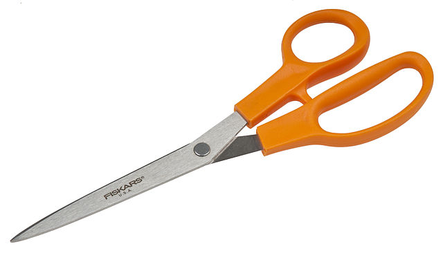 A pair of scissors with orange plastic handles, the best-known product by Fiskars