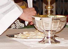 The Breaking of Bread (fractio panis) in the Eucharist at a Neocatechumenal Way celebration Fractio-panis1.JPG