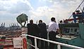 Container ship at mooring, captain at the driving and steering stand in the bridge wing - 2009