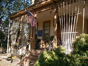 Front porch of manion bedecked for Halloween 2011 Hale-Whitney Mansion porch.jpg