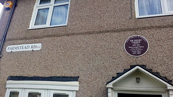 Plaque showing former home of heavyweight boxing champion Henry Cooper at 120 Farmstead Road, Bellingham, London Borough of Lewisham