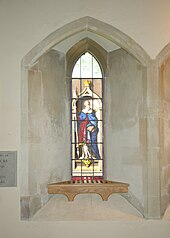 Painted glass window in St Giles' parish church presented in 1740 to commemorate the legend that John Copcot used his copy of Aristotle to kill a wild boar in Shotover Forest Horspath StGiles WindowCopcot.JPG