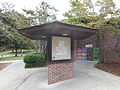 The billboard kiosk is also mid-century modern, but is slightly less modest than the bathrooms.