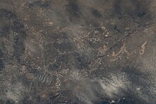 View of the city through the clouds on July 1, 2022, taken from the International Space Station with north oriented towards the left ISS067-E-170859 Colorado Springs through the clouds.jpg