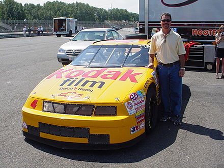 Ernie Irvan with one of his Morgan-McClure Motorsports race winning cars at a Historic Stock Car Racing Series event.