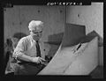 Italian-American at work on a model of a military plane 8d17204v.jpg