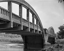 Rainbow Bridge, designed by James Barney Marsh, located over the Raccoon River southwest of Lake City. Lake City Rainbow Bridge.jpg
