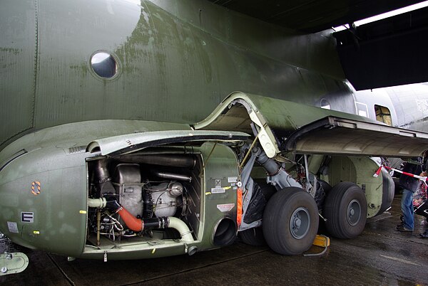 The auxiliary power unit and port-side main landing gear of a Luftwaffe C-160, 2008