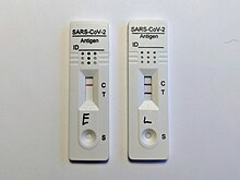 SARS-CoV-2 rapid tests showing a negative and a positive result Lateral flow covid 19 negative and positive test.jpg