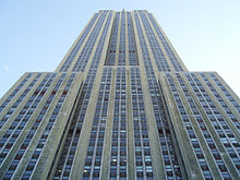 A series of setbacks causes the building to taper with height. Looking Up at Empire State Building.JPG