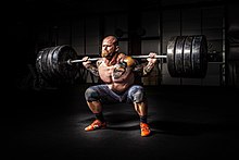 Man lifting Man lifting a heavy barbell.jpg