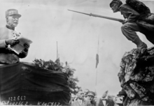 Philippe Petain inaugurates the L'Assaut monument by sculptor Alexandre Daoust at the citadel's French cemetery on the 11th. Marechal Petain (1927) - inauguration du monument l'Assaut a Dinant.png