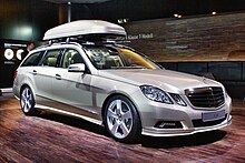 Enclosed car top carrier attached to a factory-installed roof rail Mercedes-Benz E 500 T with roofbox IAA 2009.JPG