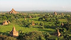 Bagan, the capital of the Bagan Kingdom. Between the 11th and 13th centuries, more than 10,000 temples, pagodas and monasteries were constructed in the Bagan plains. Old Bagan, Myanmar, Bagan plains at sunset.jpg